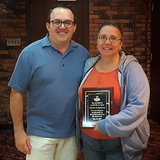 Association Manager, Scott Ullian presents board member, Karen Stropkovic with a plaque for her 20+ years of service.
